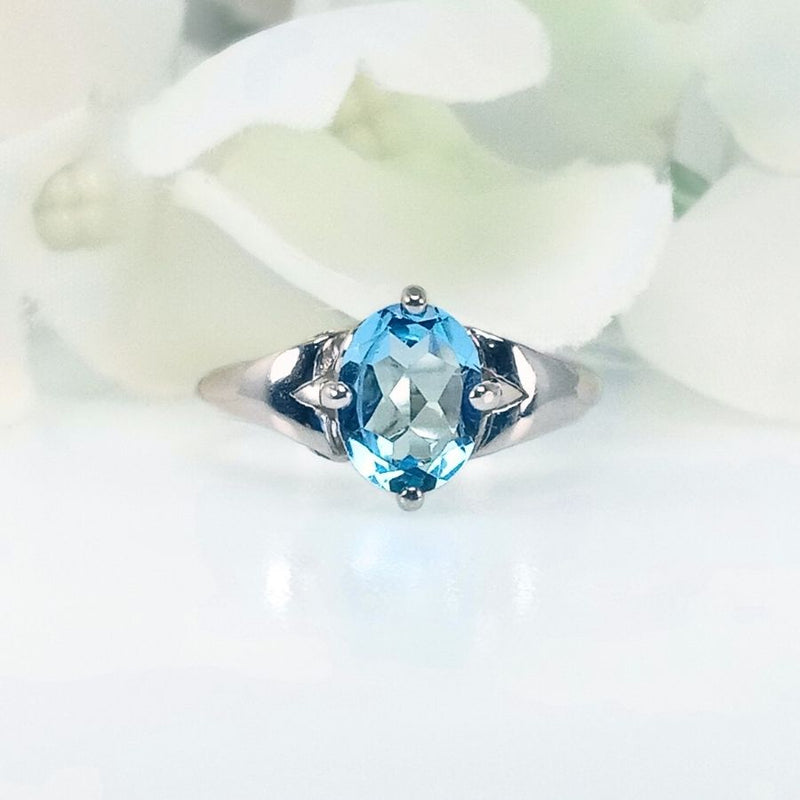 Front view of the Celeste Azure ring featuring a vibrant blue Topaz set in smooth 925 Sterling Silver