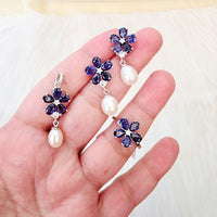This exquisite set showcases deep royal blue sapphire set include ring, earrings and pendant arranged in a delicate floral pattern, symbolizingbeauty, wisdom, and sophistication. Each piece is thoughtfully crafted to complement the other, creating a harmonious and luxurious look.
