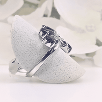 set in an intricately detailed silver band