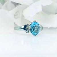 showcasing its elegant and bold design with the vibrant blue Topaz