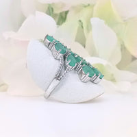 featuring a group of verdant green gems