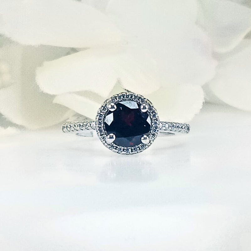 Front view of Women's Scarlet Passion Deep Red Garnet Ring in 925 Sterling Silver featuring a round crimson garnet gem in a sleek, intricate royal design