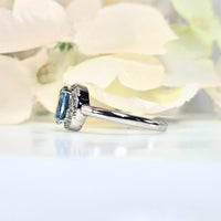 featuring a bright blue gemstone. High-quality
