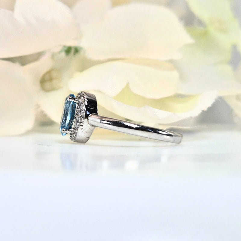 featuring a bright blue gemstone. High-quality
