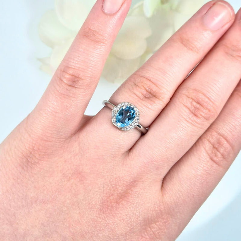 featuring a bright blue gemstone. High-quality