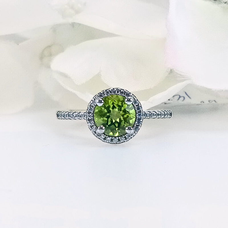 Close-up view of the Lush Lime Peridot Ring, showcasing a round lime-green peridot gemstone set in 925 sterling silver