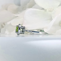 showcasing a round lime-green peridot gemstone set in 925 sterling silver