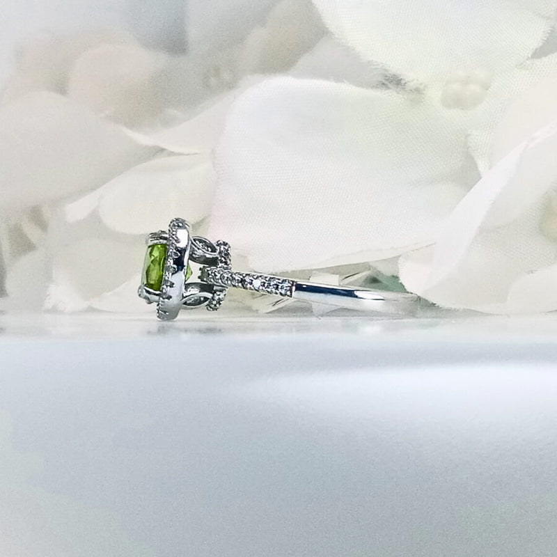 showcasing a round lime-green peridot gemstone set in 925 sterling silver
