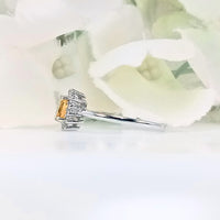 Perspective view of citrus yellow citrine ring in 925 sterling silver