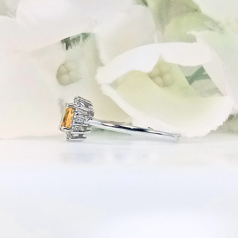 Perspective view of citrus yellow citrine ring in 925 sterling silver