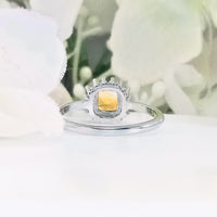 highlighting the depth and elegant design of the radiant gemstone set in the polished band