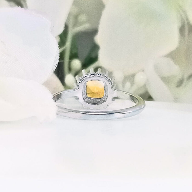 highlighting the depth and elegant design of the radiant gemstone set in the polished band