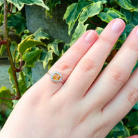 highlighting the smooth band and elegant setting of the radiant citrine gemstone