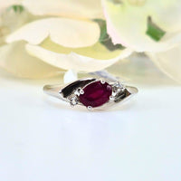 Authentic 925 sterling silver ruby ring for women, featuring a vibrant red gemstone. High-quality, original design symbolizing passion, vitality, and positivity. Front view showcasing the detailed craftsmanship