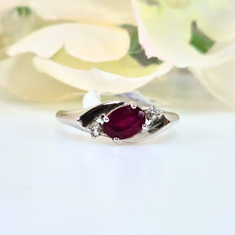 Authentic 925 sterling silver ruby ring for women, featuring a vibrant red gemstone. High-quality, original design symbolizing passion, vitality, and positivity. Front view showcasing the detailed craftsmanship