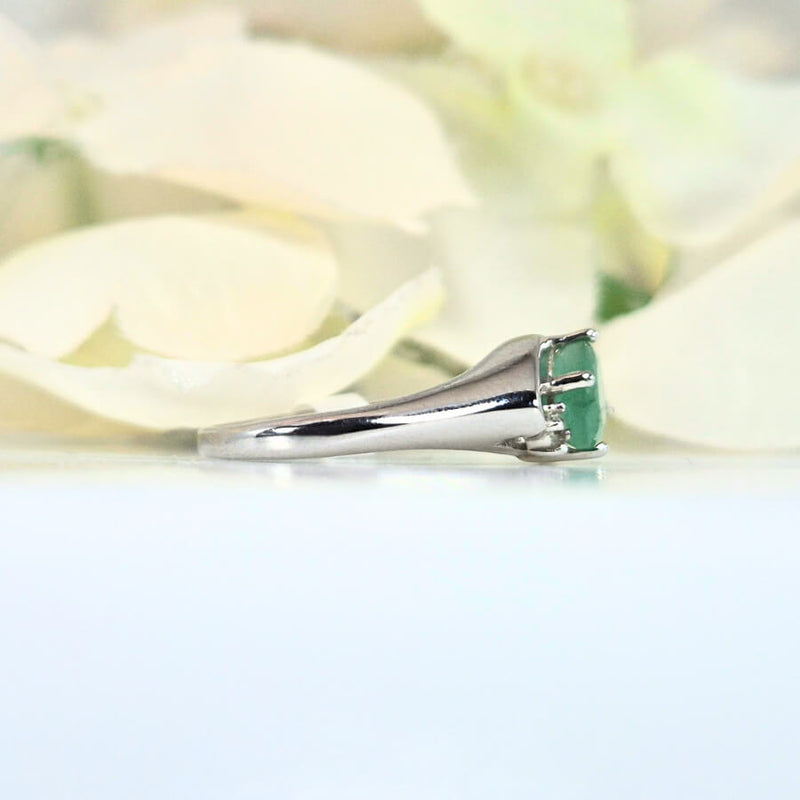 featuring a vibrant green gemstone. High-quality