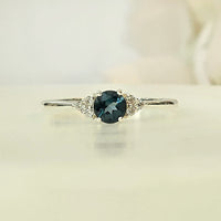 London's Topaz Symphony  in real natural original London Blue Topaz in 925 silver for birthstone, party, or casual wear. light weight, delicate, dainty designer jewellery