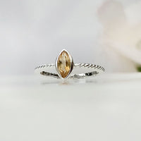 Yellow marquise shape real natural original citrine ring in 925 silver with twisted band design for birthstone, party, or casual wear. light weight, delicate, dainty designer jewellery