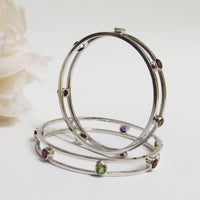 The 7 Chakras Bangle - Peridot, Garnet, Citrine, Amethyst, Ruby, Topaz, Sapphire