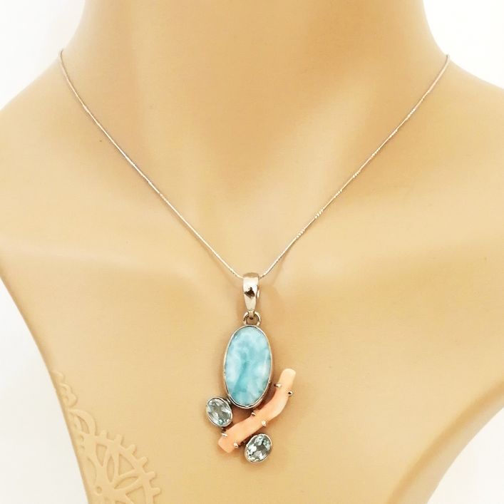 Riverine Pendant - Larimar, Coral & Topaz in high quality silver ready available at Nafisa Designs, Manchester UK. Free Global Shipping!
For Inquiries Call or WhatsApp: +447878581702 OR +96567725075